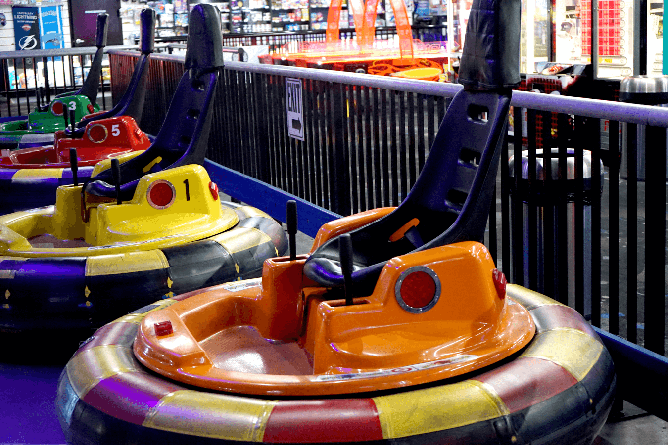 Spin Zone Bumper cars lined up against wall