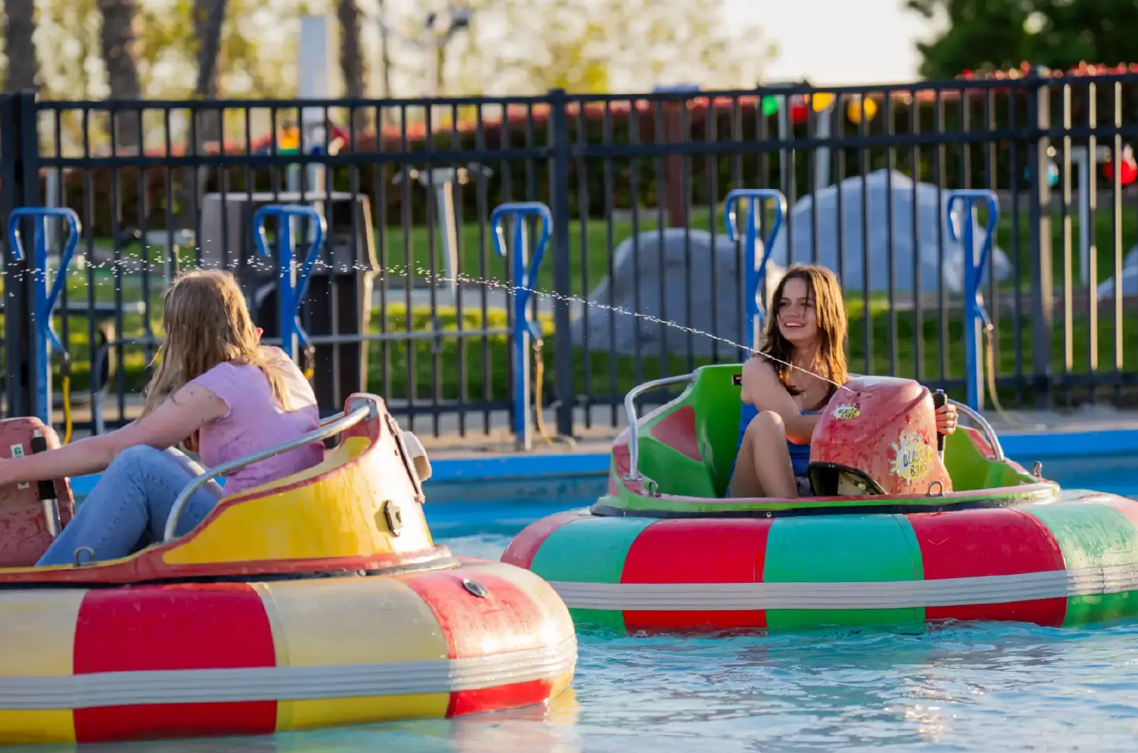 girls play on bumper boats at boomers boca raton