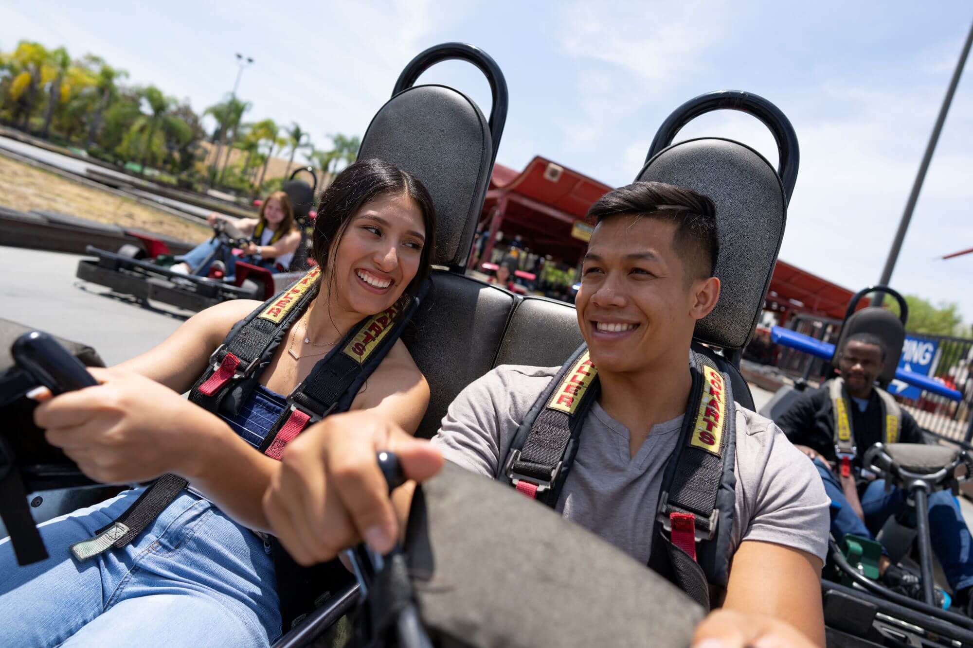 Couple driving a go kart