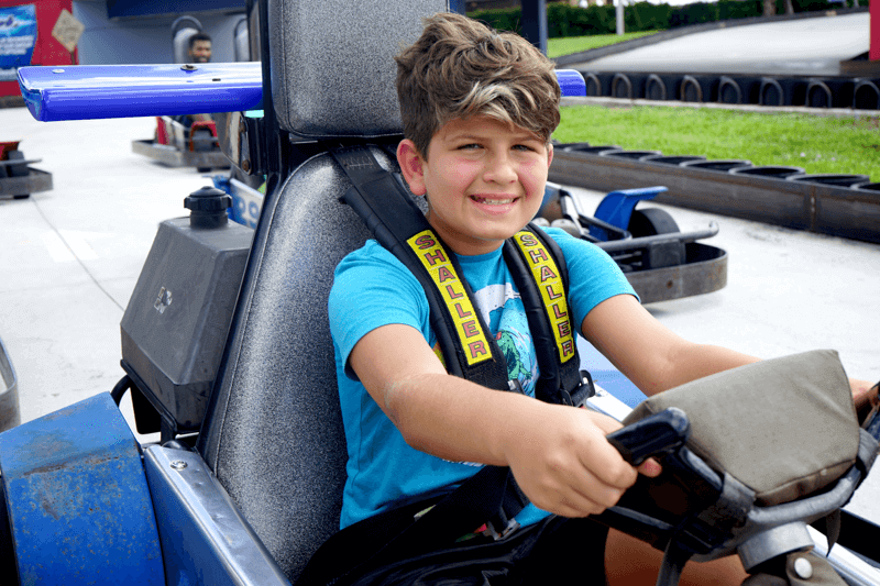 Boy drives rookie go kart