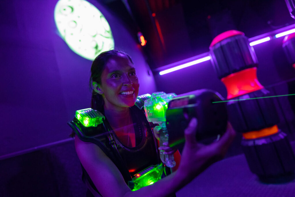 Lady playing lazer tag at Boomers