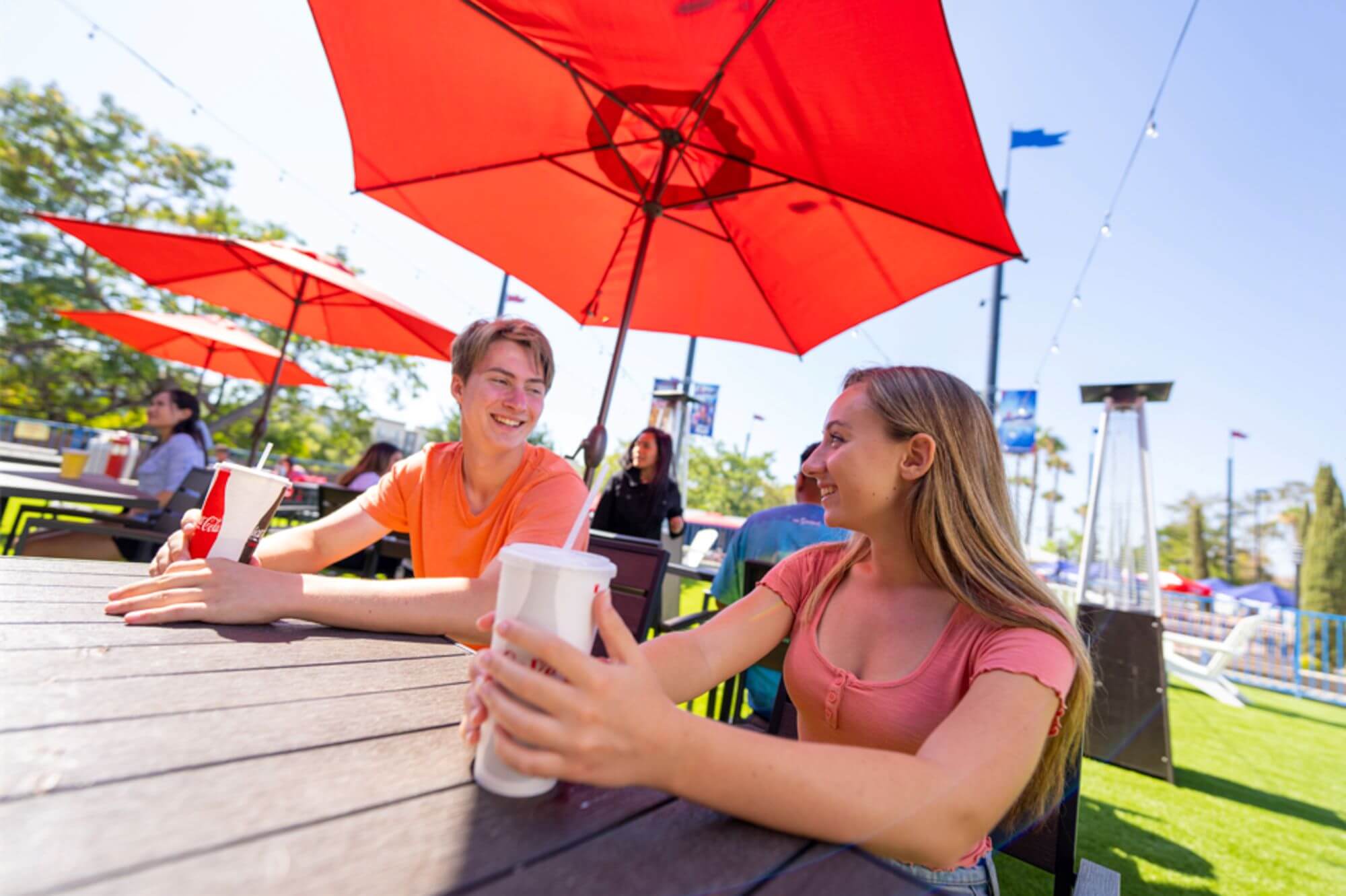 Couple enjoying drinks in Boomers Backyard