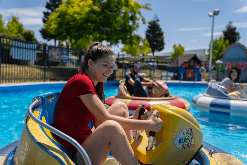 Smiling girl on bumper boat