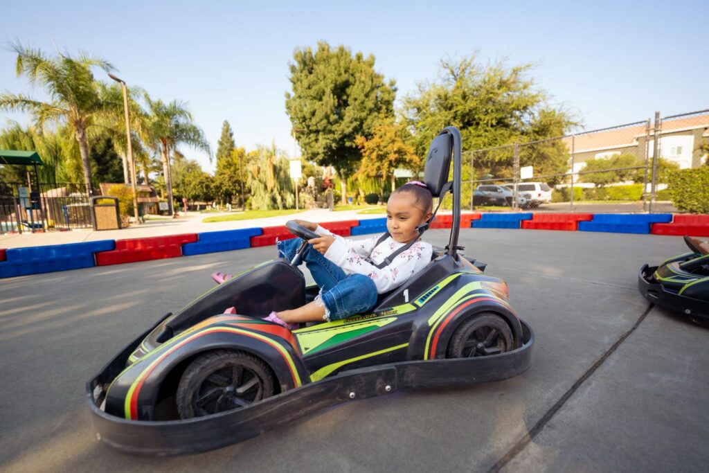 girl driving a Kritter Kart children go kart