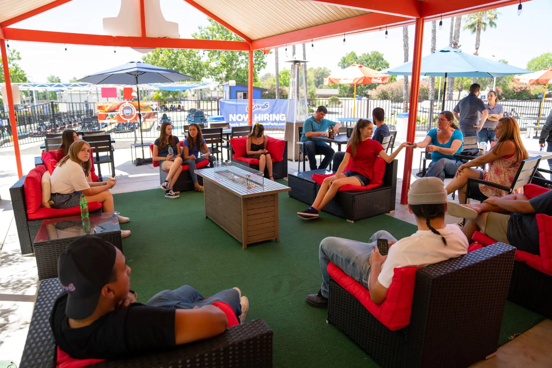 Group sitting under canopy in Boomers Backyard