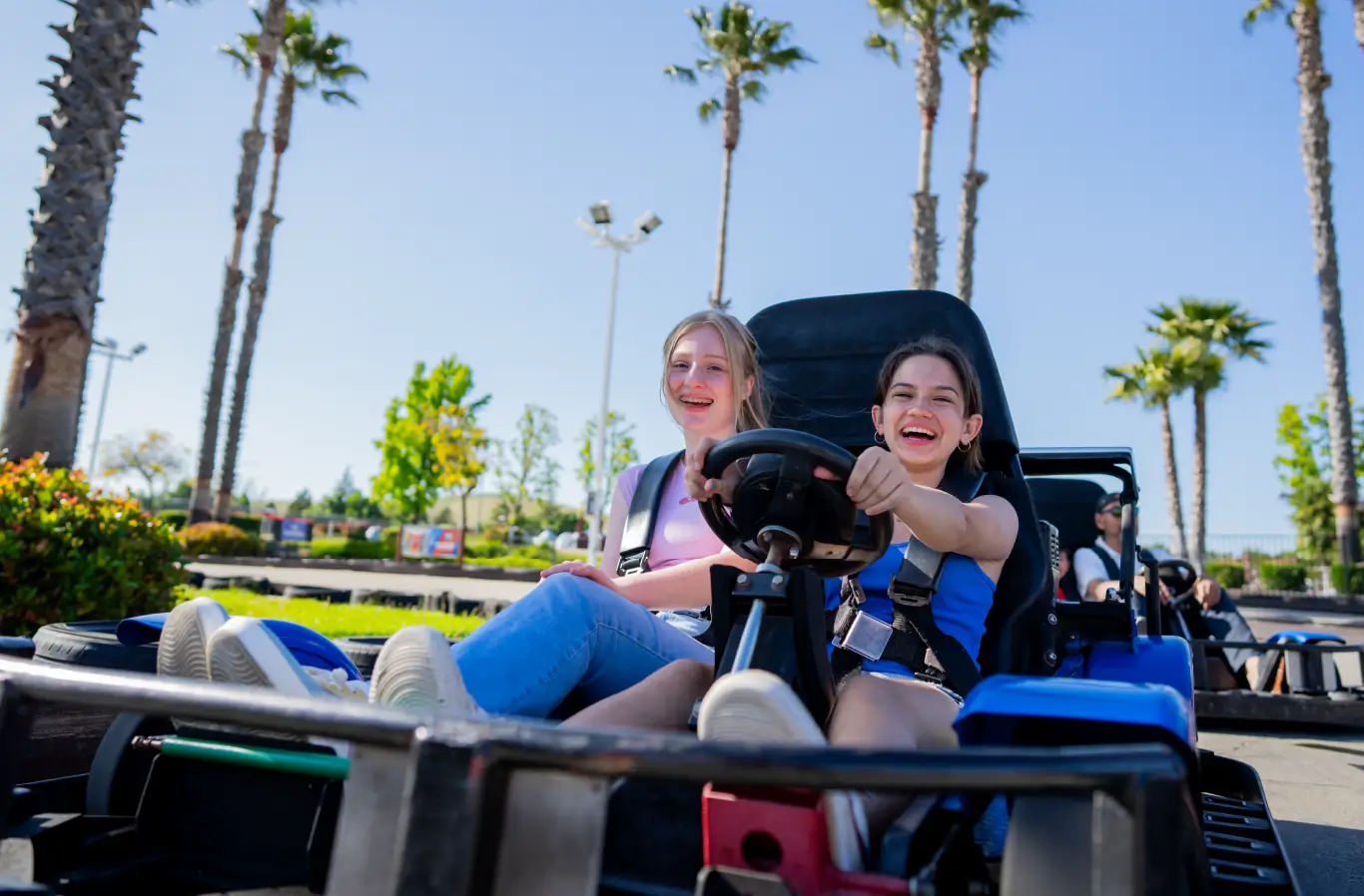 girls drive go kart at Boomers