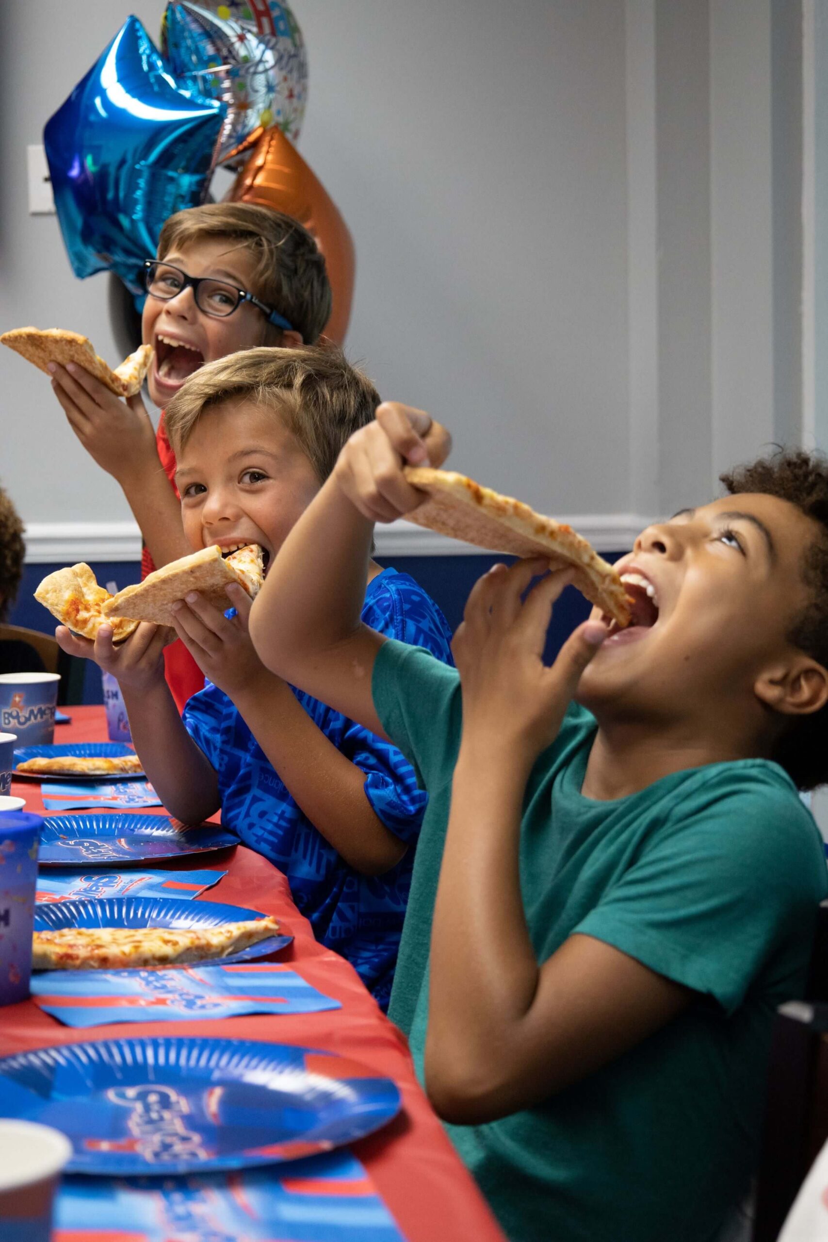 Kids-Eating-Pizza-in-Party-Room-at-Boomers-Boca-Raton-2023-scaled-1.jpg