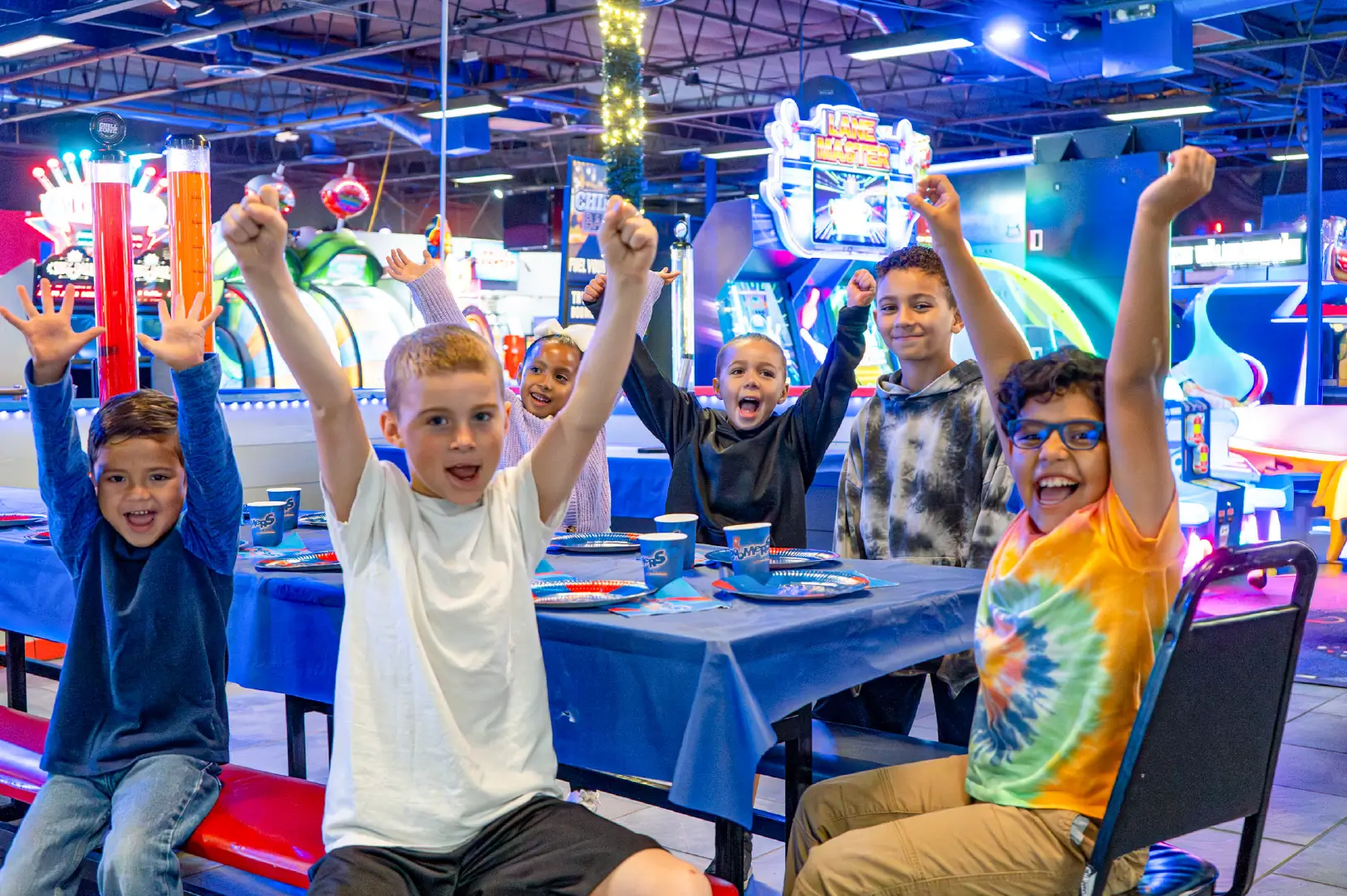 boys in the arcade at a Boomers birthday party